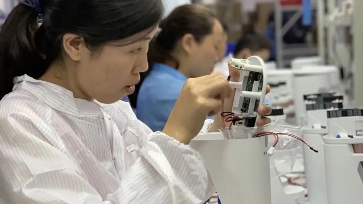 Precision electronics work at the Shenzhen facility